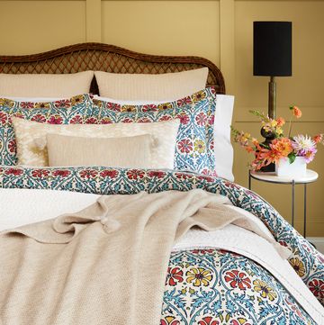 john robshaw floral and cream bedding on bed