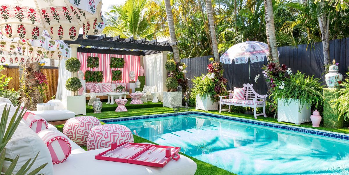 the janie molster–designed poolside lounge in a variety of pink florals and stripes at the 2022 kips bay show house 2022 © nickolas sargent