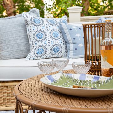 outdoor furniture, coffee tbale, blue, white and gray decorative cushions