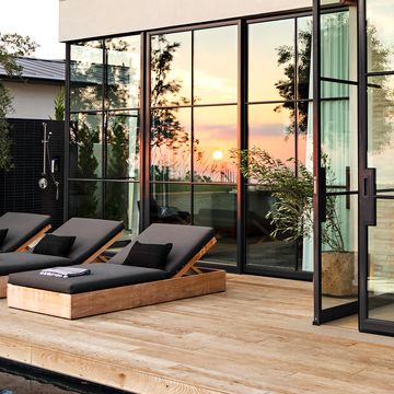 modern deck with glass windows and pool