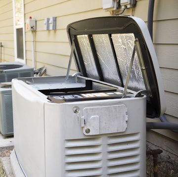 senior adult air conditioner technicianelectrician services outdoor ac unit and the gas generator