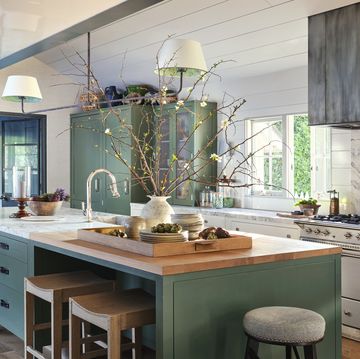 interior designer jeffrey alan marks' american colonial revival home near butterfly beach in montecito, california kitchen cabinetry and knobs plain english paint strong white, farrow ball walls and white cabinets dripping tap, plain english green cabinets pendant the urban electric co with custom shades faucet waterworks counter stools custom, jam for palecek wood jam for a rudin in rose tarlow range lacanche range hood custom zinc, mainz builders leather pulls custom, richard wrightman