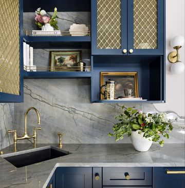 blue kitchen with brass accent