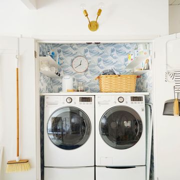 laundry closet with wave wallpaper
