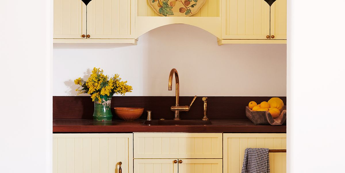small kitchen with yellow paint