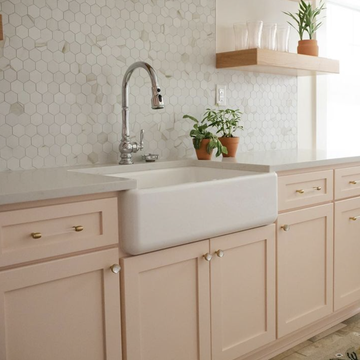 peachy pink paint on kitchen cabinets